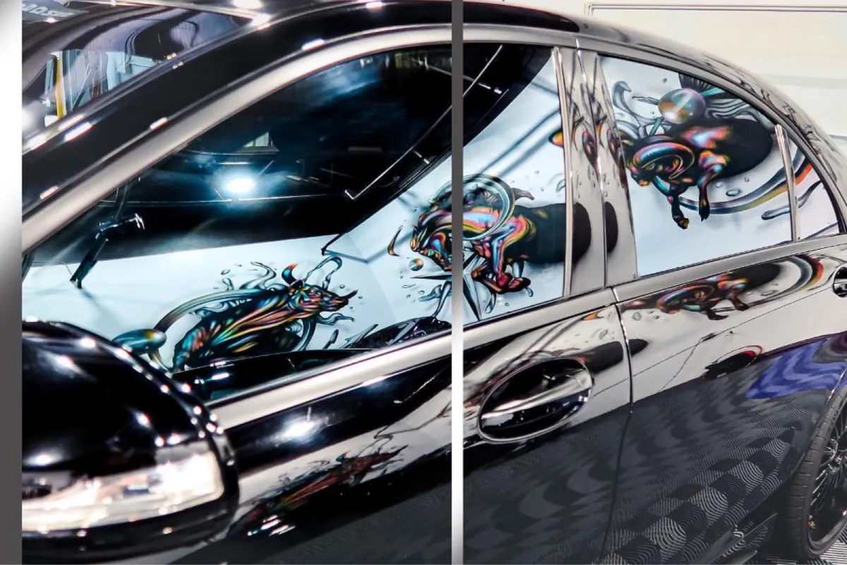 Close-up of black Mercedes sedan window with vibrant colorful reflection and detailed artwork