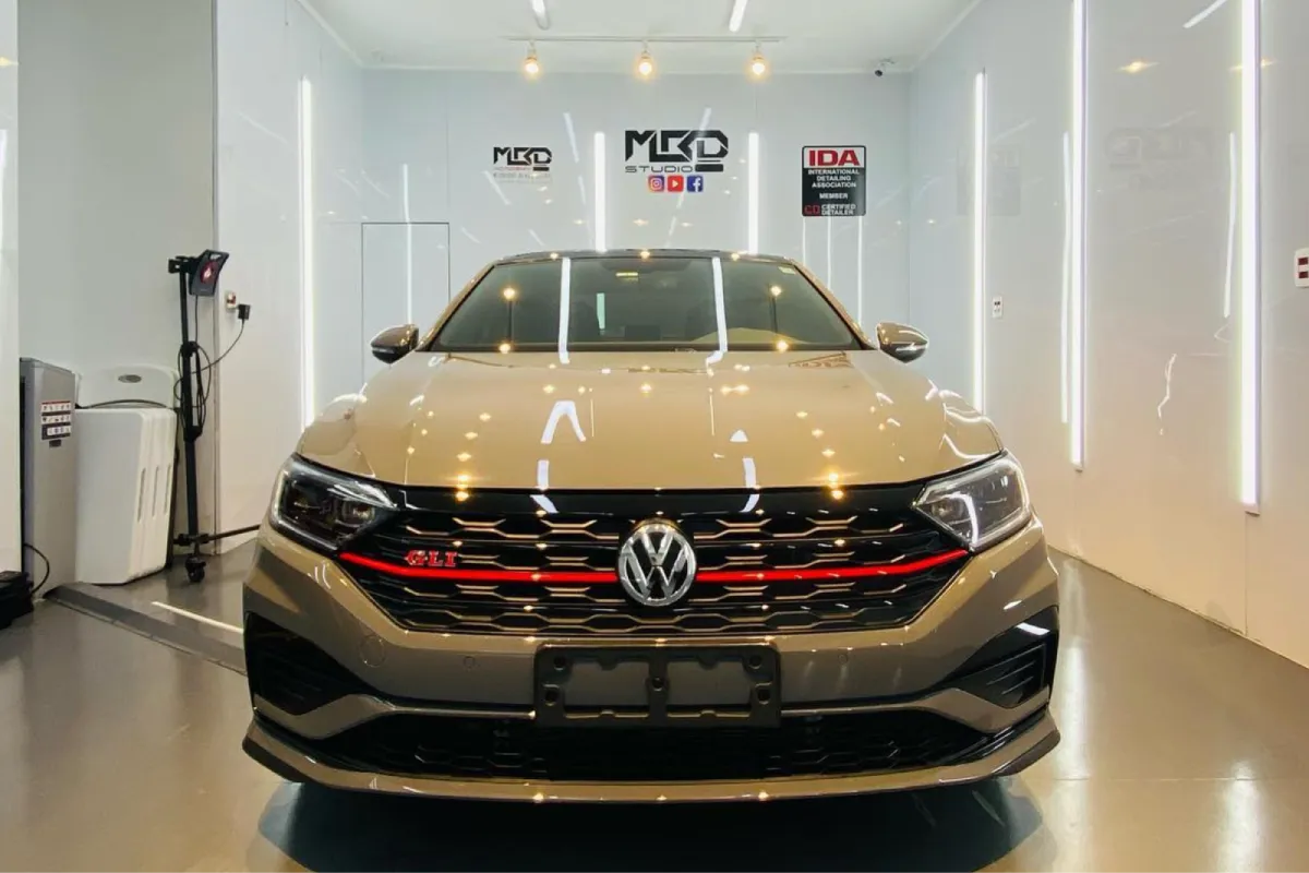Front and angled view of GLI on lift inside auto detailing shop