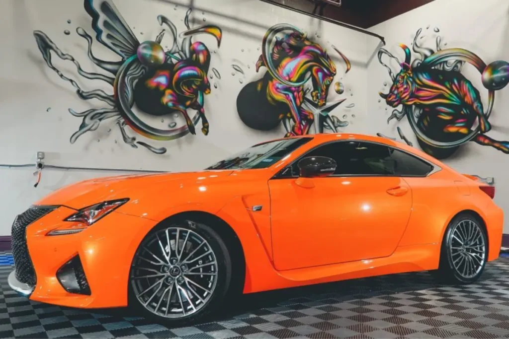 Orange Lexus coupe with glossy ceramic coating finish.